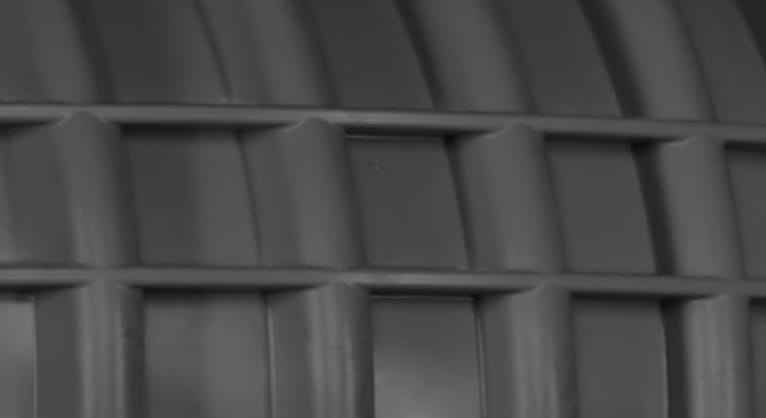A close-up dark grey abstract pattern